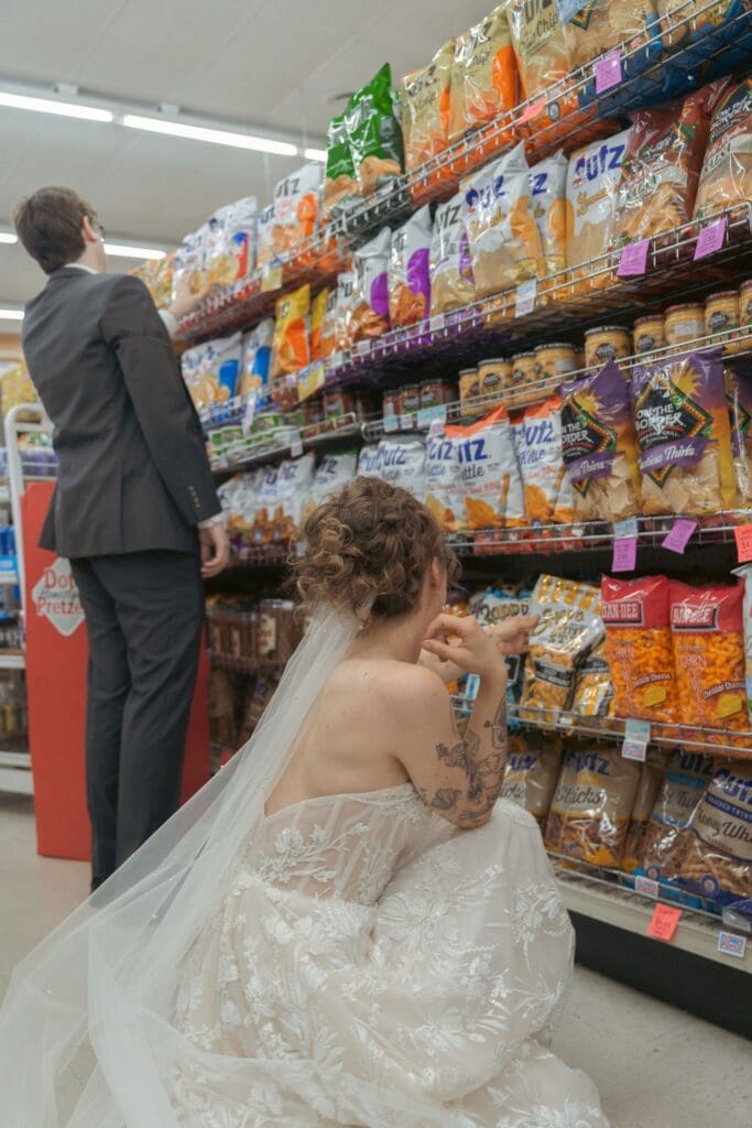 Bride and groom in a grocery store looking at chips