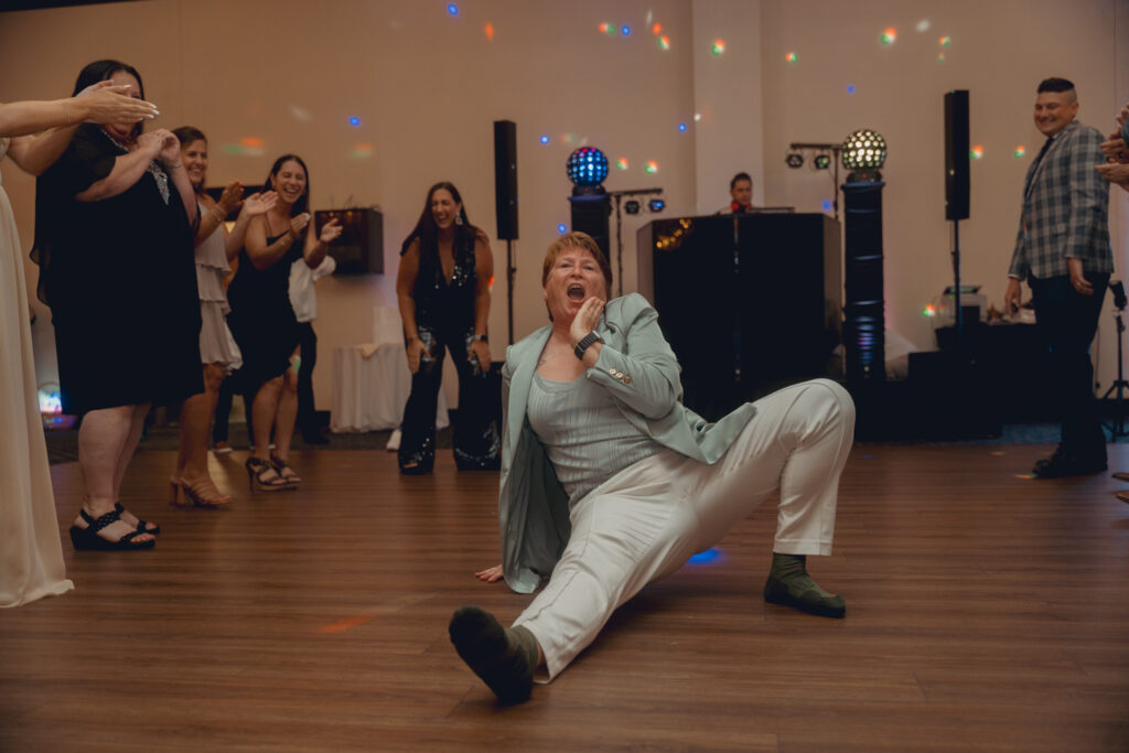 Wedding guest dancing on the dancefloor at the reception