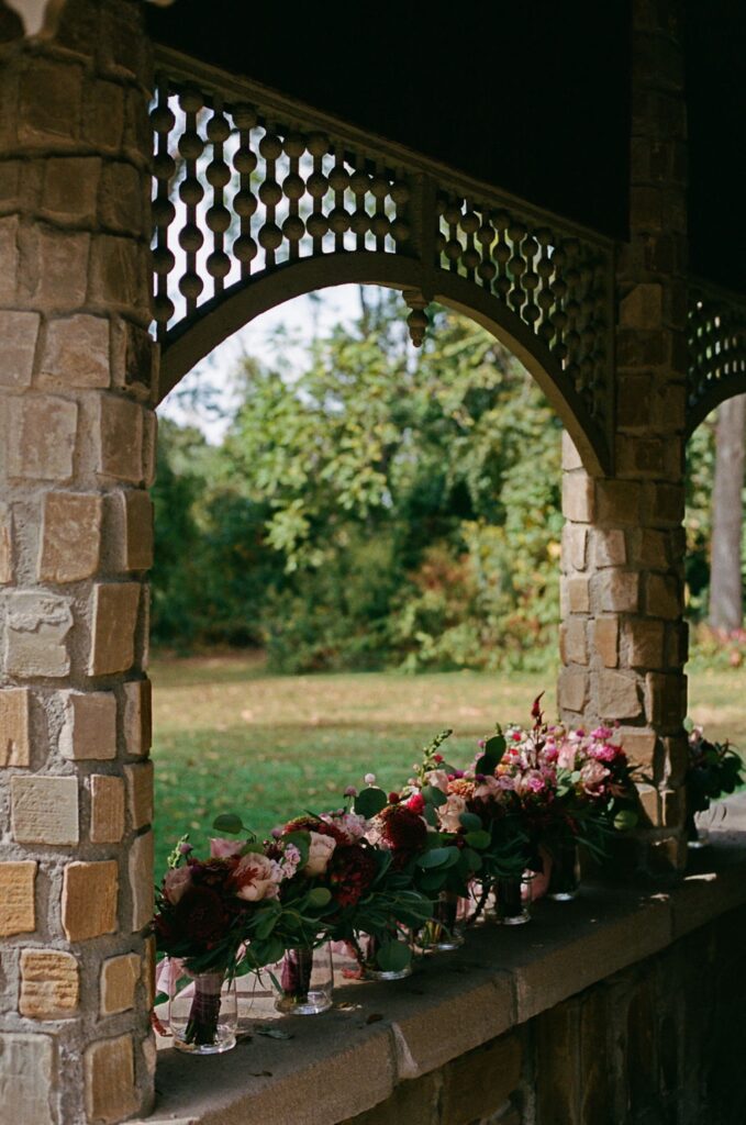 Wedding bouquets sitting on a stone wall