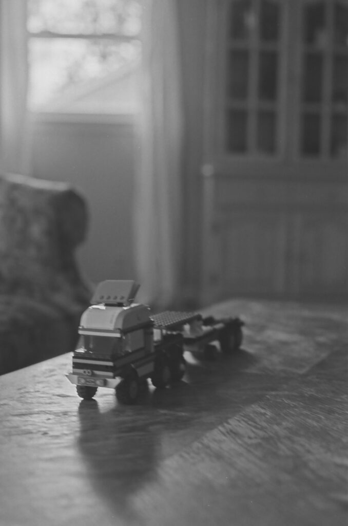 Black and white film photo of a lego truck